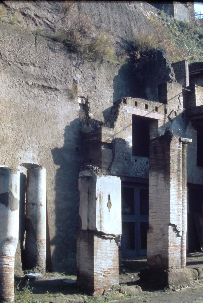 Decumanus Maximus, Herculaneum, north side. 4th December 1971.
Looking towards north side of roadway, with doorway numbered 1, on right behind pillar. 
Photo courtesy of Rick Bauer, from Dr George Fay’s slides collection.
