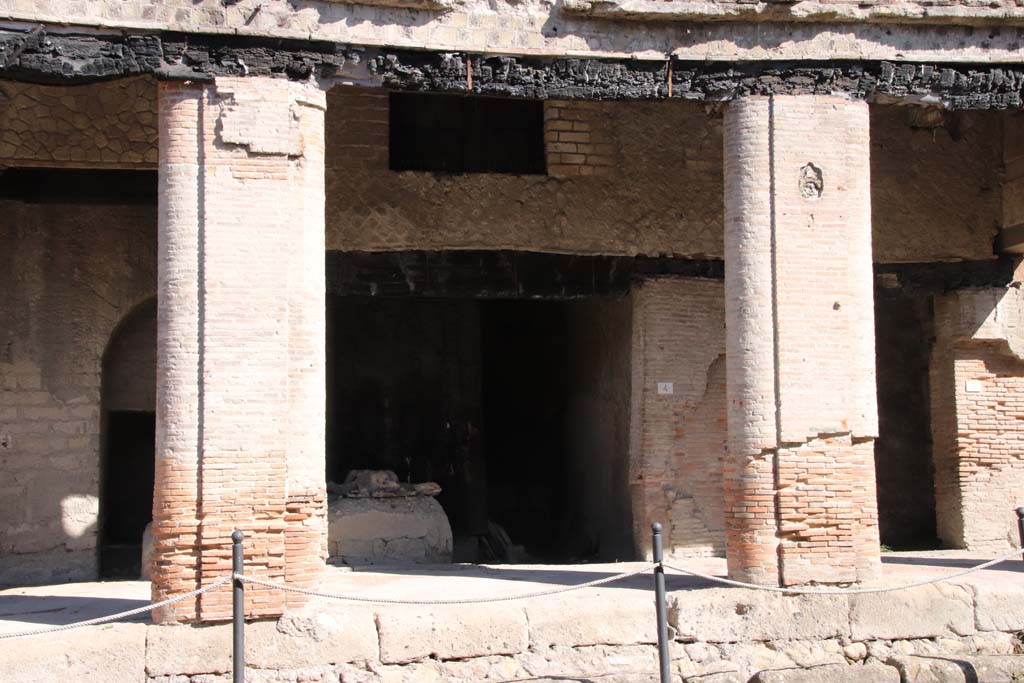 Decumanus Maximus, Herculaneum, October 2020. 
Building on north side of the Decumanus Maximus, entrance doorway of shop numbered 4 under portico. Photo courtesy of Klaus Heese.
