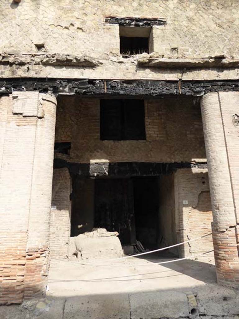 Decumanus Maximus, Herculaneum, October 2014.  Building on north side of the Decumanus Maximus, doorway to shop numbered 4. Photo courtesy of Michael Binns.
