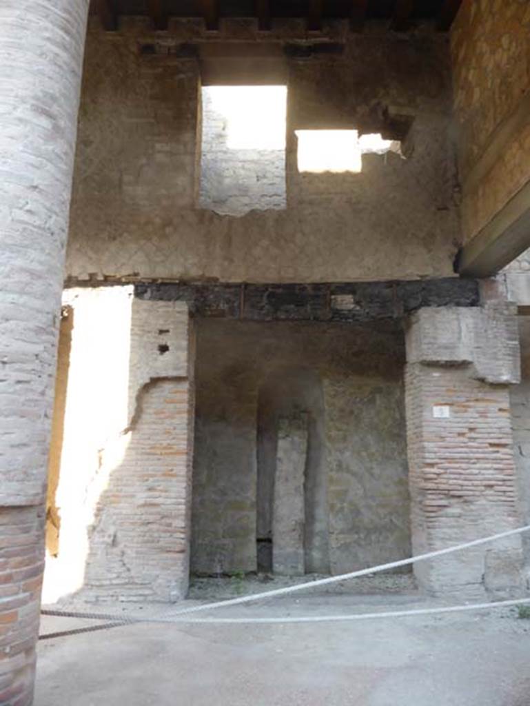 Decumanus Maximus, Herculaneum, September 2015. 
Building on north side of the Decumanus Maximus, doorway numbered 5.
