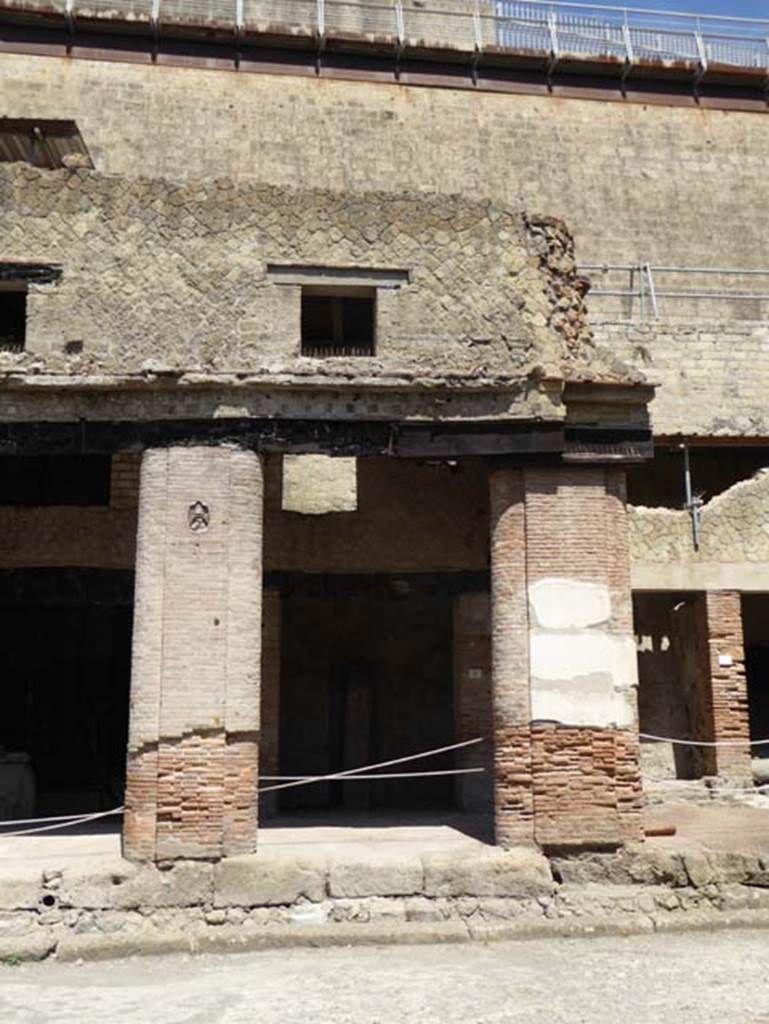 Decumanus Maximus, Herculaneum, July 2015.   Building on north side of the Decumanus Maximus, doorway and upper floors, numbered 5.  Photo courtesy of Michael Binns.
