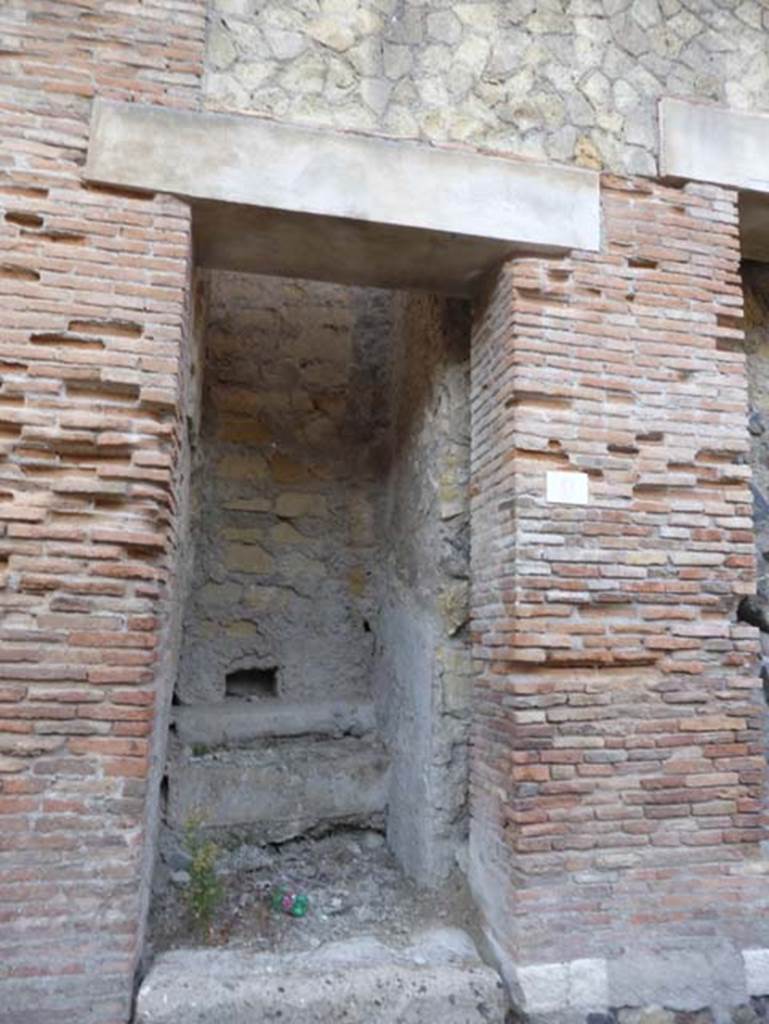 Decumanus Maximus, Herculaneum, September 2015. 
Building on north side of the Decumanus Maximus, doorway numbered 9.
