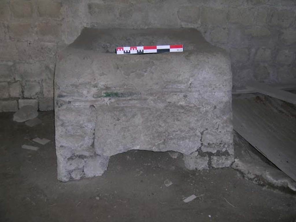 II.1, Herculaneum, May 2006. Stone furnace from the largest of the lower rooms, at the side of it was a dolium was found buried in the flooring.
Photo courtesy of Nicolas Monteix.

