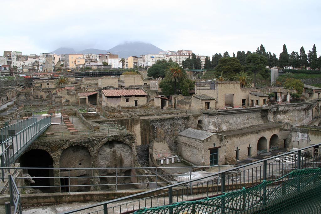 III.1/2/18/19, Herculaneum, March 2008. Looking north from access roadway towards upper and lower rooms, on right.
Note the access bridge leading onto the southern large terrace with remains of collapsed massive square pilasters.
Photo courtesy of Sera Baker.
