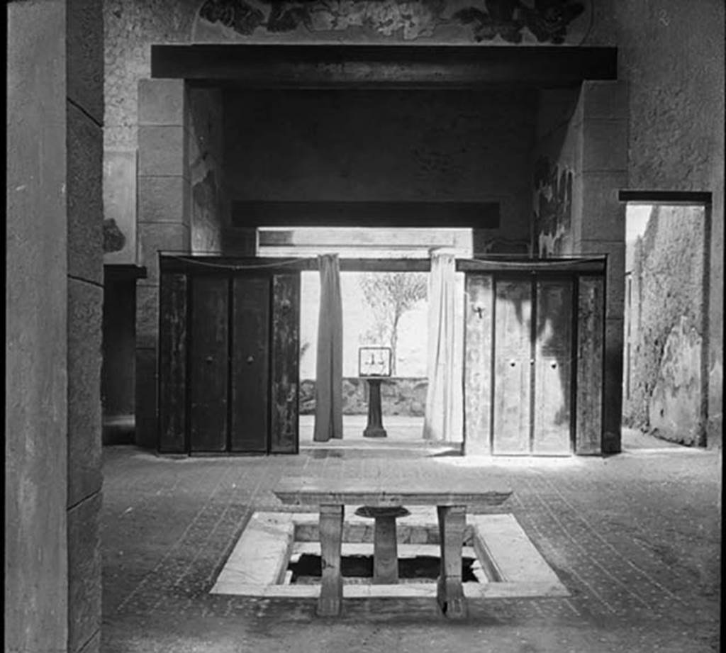 III.11 Herculaneum. Photo by Theodor Benzinger. 
Looking west across atrium 6 towards wooden screen/partition into tablinum, from entrance corridor 1.
Used with the permission of the Institute of Archaeology, University of Oxford. File name INSTARCHbx21im001 Resource ID 37883.
See photo on University of Oxford HEIR database

