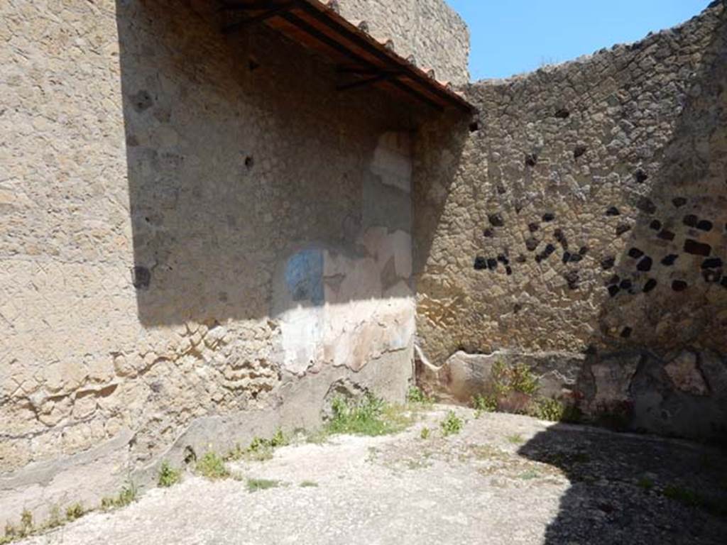 III.16, Herculaneum, May 2018. 
Triclinium 8, looking along west wall with remains of painted decoration towards north-west corner. 
Photo courtesy of Buzz Ferebee
