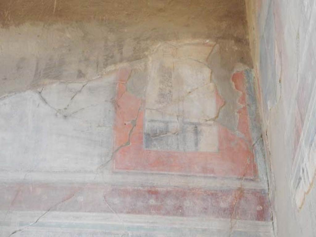 III.16, Herculaneum, May 2018. Room 9, detail of painted decoration on upper south wall in south-west corner. 
Photo courtesy of Buzz Ferebee
