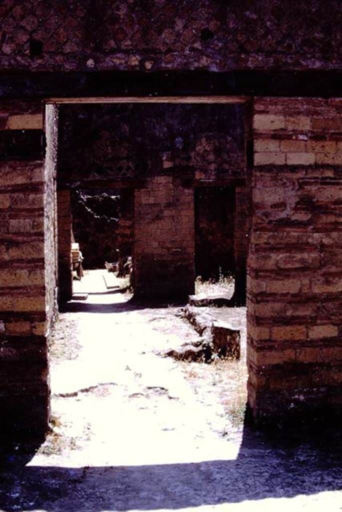 IV.4 Herculaneum. 1978. Looking east from open courtyard. Photo by Stanley A. Jashemski.   
Source: The Wilhelmina and Stanley A. Jashemski archive in the University of Maryland Library, Special Collections (See collection page) and made available under the Creative Commons Attribution-Non Commercial License v.4. See Licence and use details. J78f0517


