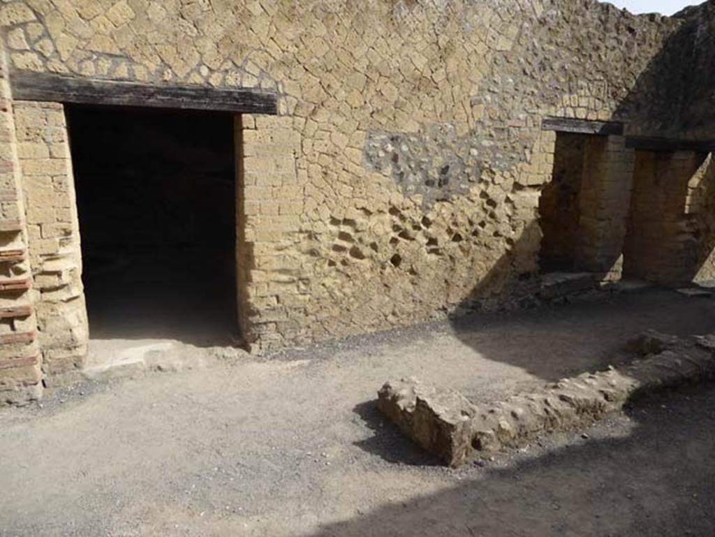 IV.4, Herculaneum, October 2014. Room 7, looking towards north wall of covered atrium, with doorways to oecus 8, on left, and room 9. Photo courtesy of Michael Binns.
