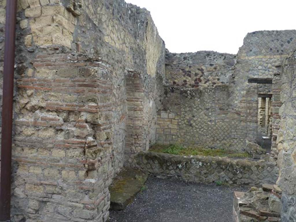 IV.4 Herculaneum. September 2015. Room 16, looking west from triclinium through doorway into courtyard 12, from where it would have taken light and air.