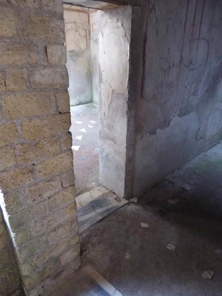 IV.4 Herculaneum. October 2014. Room 23, doorway in west wall into room 24.
Photo courtesy of Michael Binns.
