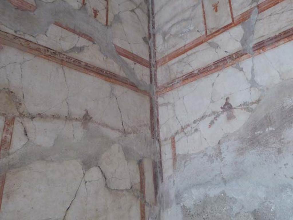IV.4 Herculaneum. October 2014. Room 24, detail of painted decoration in north-west corner.  Photo courtesy of Michael Binns.
