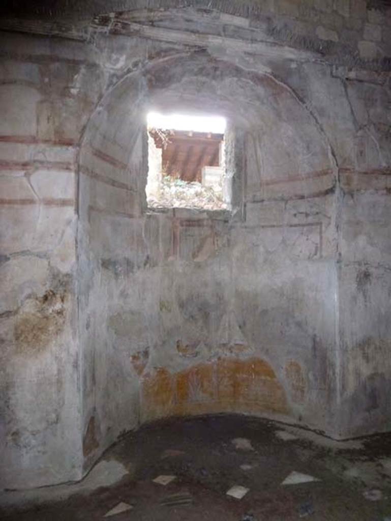 IV.4 Herculaneum. October 2012. Room 24, south wall with alcove or apse. 
The window gave light to the room from the courtyard 22. Photo courtesy of Michael Binns.

