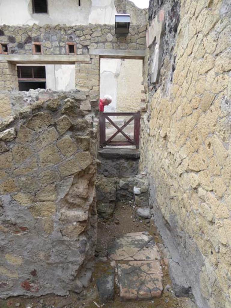 IV.8 Herculaneum, October 2015. Looking west into latrine, which would have been under the stairs, entered at IV.9.  Photo courtesy of Michael Binns.
