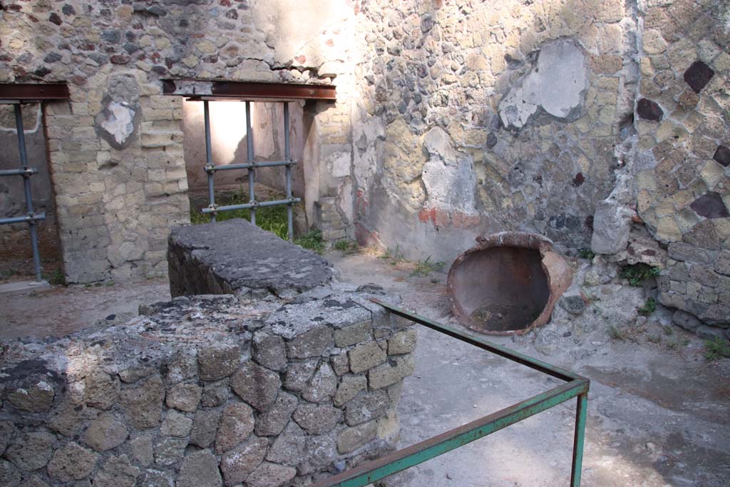 IV.17 Herculaneum. September 2019. Looking west across bar-room towards north-west corner and north wall.
Photo courtesy of Klaus Heese.
