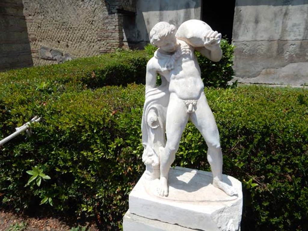 IV.21, Herculaneum. May 2018. Statue of Satyr with wineskin. Photo courtesy of Buzz Ferebee. 

