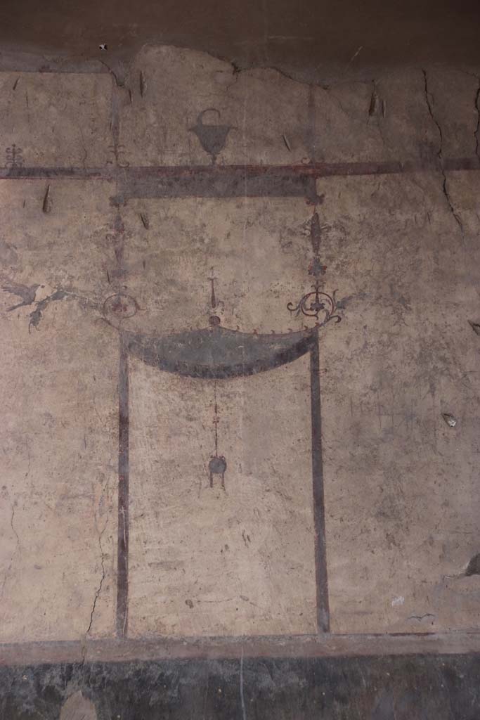 IV.21, Herculaneum. October 2020. 
Room 24, painted decoration from north end of upper west wall in atrium. Photo courtesy of Buzz Ferebee. 
