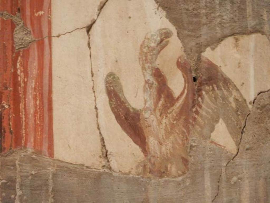 V.8 Herculaneum, May 2018. Room 3, detail of painted decoration on upper west wall of small tablinum. 
Photo courtesy of Buzz Ferebee.
