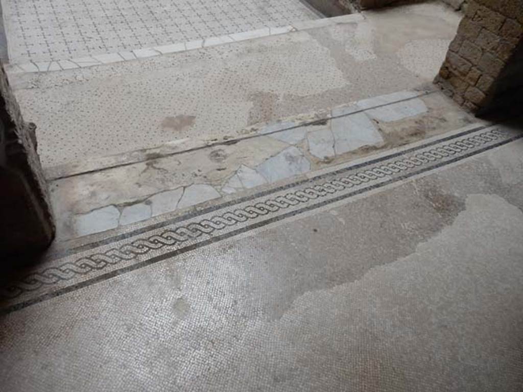 V.8 Herculaneum. May 2018. Room 7, threshold of doorway, looking north towards stairs in area 4.
Photo courtesy of Buzz Ferebee.
