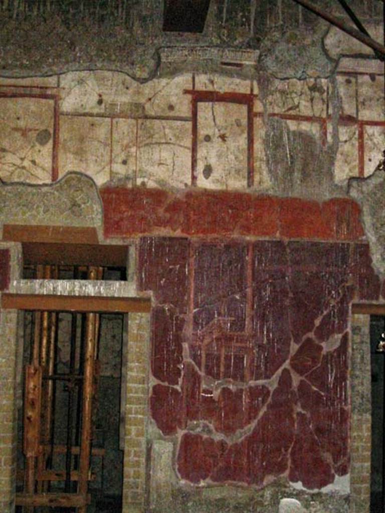 V.15, Herculaneum. May 2003. West wall of atrium on north side of central doorway on west side of atrium. Photo courtesy of Nicolas Monteix.


