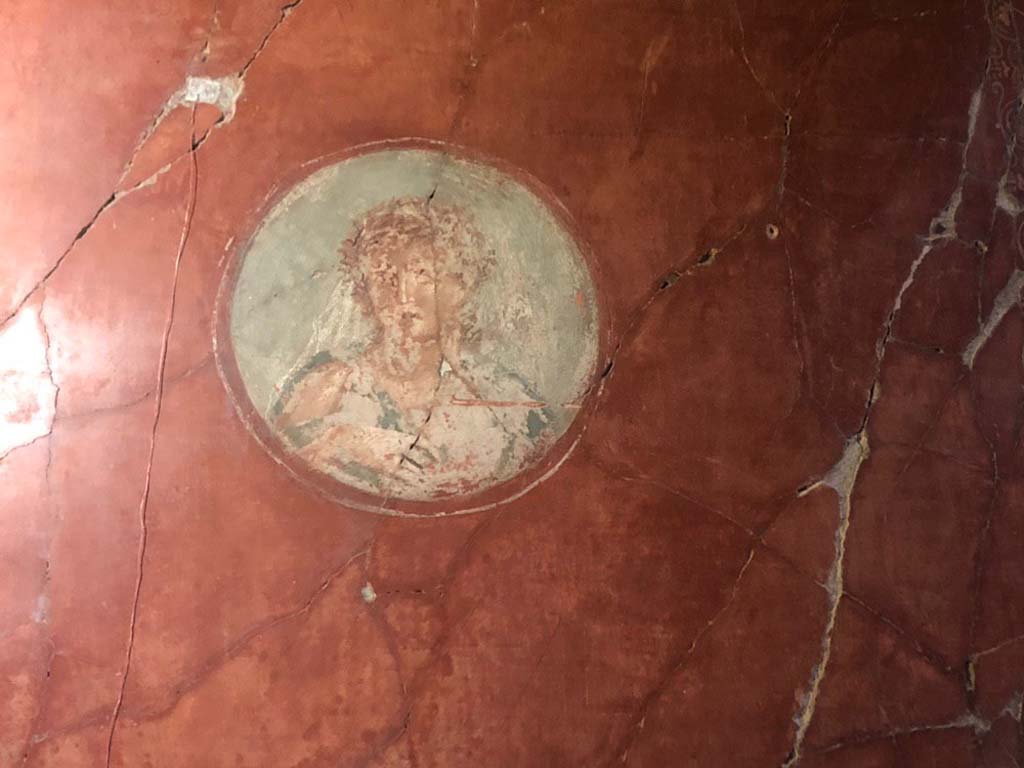V.15 Herculaneum. October 2019. West wall of tablinum at north end, medallion with painting of a Maenad.
Photograph  Parco Archeologico di Pompei.

