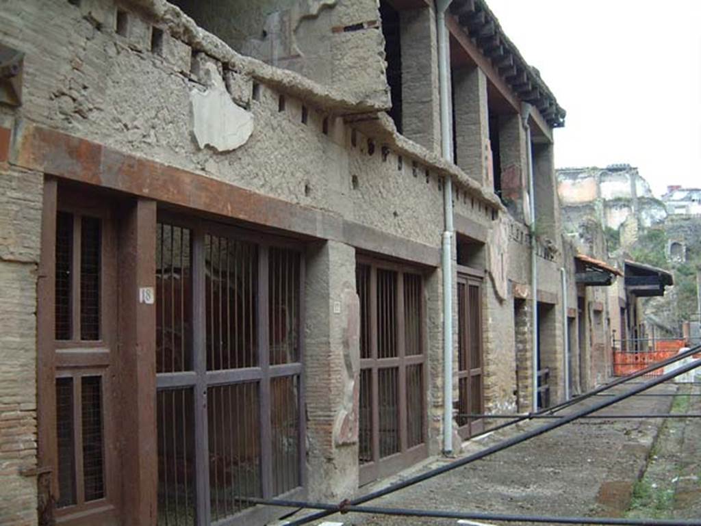 V.18 Herculaneum, on left. May 2001. Looking west along north end of insula. Photo courtesy of Current Archaeology.