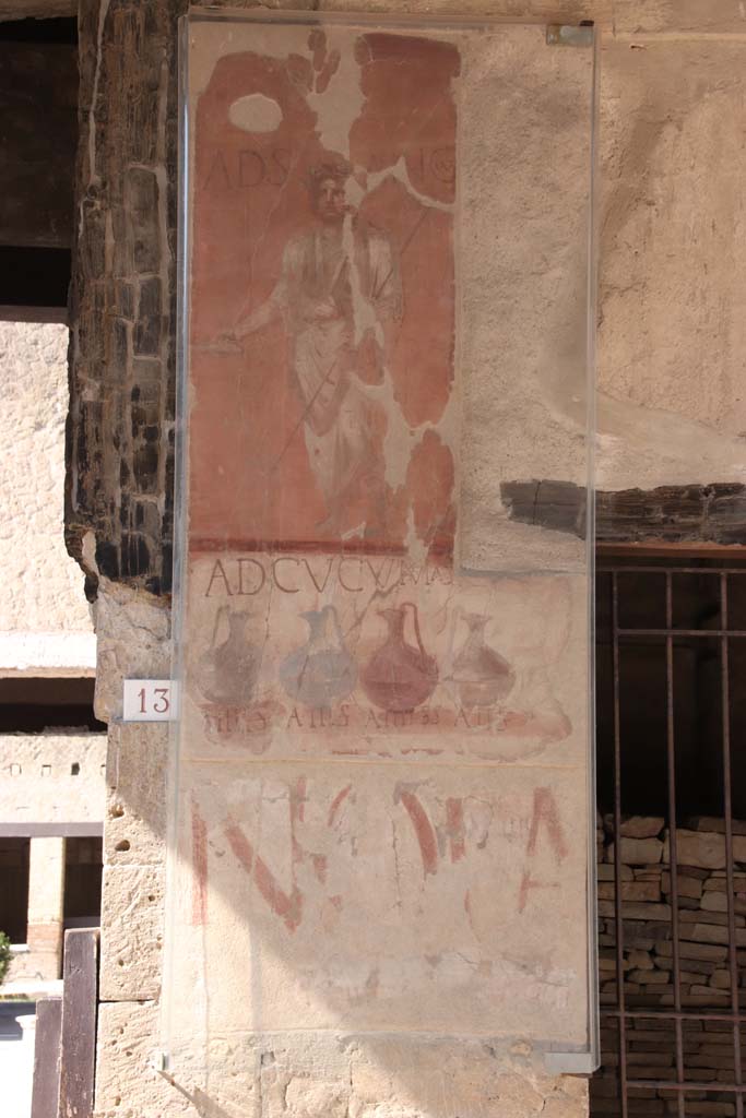 VI.13/14 Herculaneum, September 2021. 
Painted sign on pilaster between entrances 13, on left, and 14. Photo courtesy of Klaus Heese.



