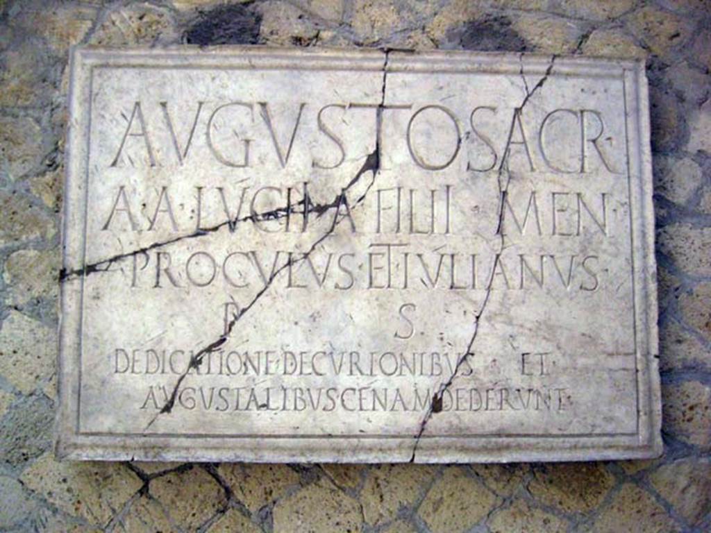 VI.21 Herculaneum. June 2011. Plaque dedicated to Augustus. Photo courtesy of Sera Baker.
