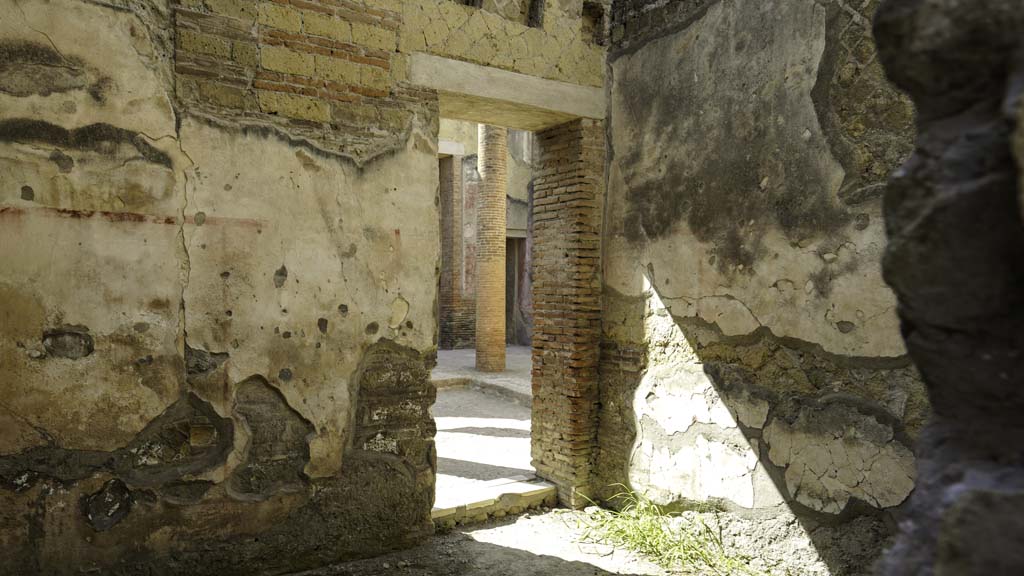 VI.28 Herculaneum, August 2021. 
Looking towards east wall with doorway to atrium, and south wall, on right. Photo courtesy of Robert Hanson.

