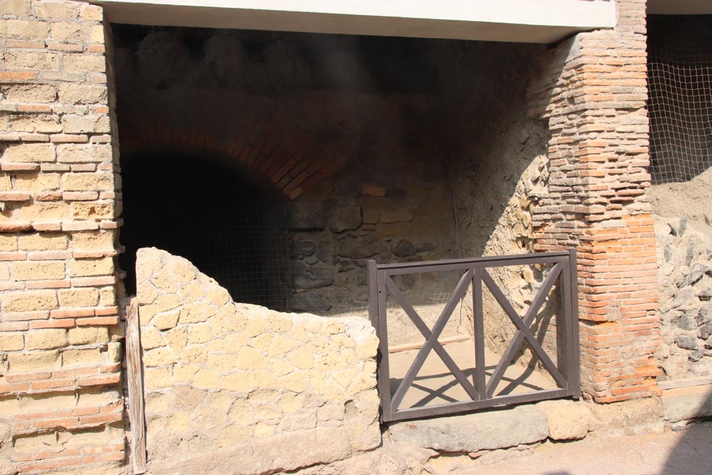 VII.12 Herculaneum. October 2023. Doorway on west side of Cardo III. Photo courtesy of Klaus Heese.