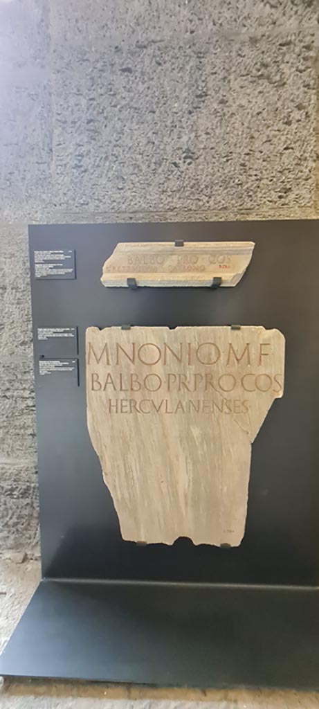 Herculaneum. April 2023. 
Displayed items in “Campania Romana” gallery of Naples Archaeological Museum. 
Top, inv. 3735, and Lower, inv. 3731.  Photo courtesy of Giuseppe Ciaramella.
(Note: At Portici in 2015, the Dedication to Marcus Nonius Balbus, inv. 3731, was attached to the base of the equestrian statue of the younger Nonius Balbus, inv. 6104.) 

Top: - Dedication to Marcus Nonius Balbus by the inhabitants of Crete.
Ercolano (Napoli), ignoratur; in situ sulla fronte del basamento di una statua equestre bronzea (secondo Alcubierre) (10 dic. 1746) 
[M(arco) Nonio M(arci) f(ilio)] Balbo proco(n)s(uli)
[commune] Cretensium patrono.      [CIL X, 1430]

Lower: - Dedication to Marcus Nonius Balbus by the inhabitants of Herculaneum.
Ercolano (Napoli), prob. nel foro (11 ag. 1746) 
M(arco) Nonio M(arci) f(ilio)
Balbo, pr(aetori), pro co(n)s(uli),
Herculanenses.       [CIL X, 1426]
