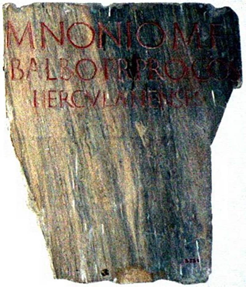 VII.16 Herculaneum. Original inscription plaque is attached to the front of statue base of 6104.
When first found this identified the statues as M. Nonius Balbus.
M(arco) Nonio M(arci) f(ilio) 
Balbo, pr(aetori), pro co(n)s(uli), 
Herculanenses.   [CIL X 1426]
Now in Naples Archaeological Museum. Inventory number 3731.
Photo courtesy of Jørgen Christian Meyer.
