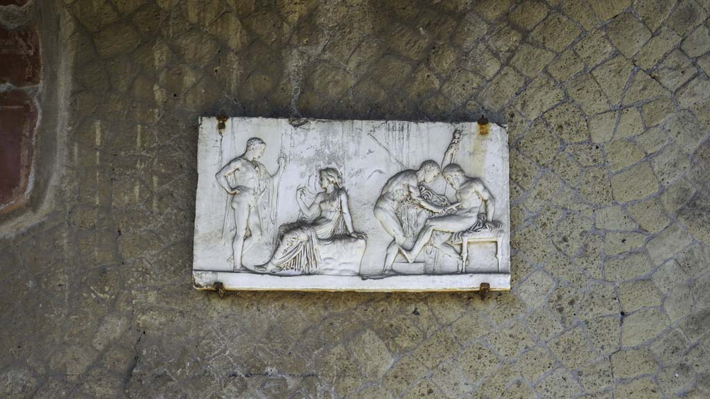Ins. Orientalis I, 2, Herculaneum, August 2021. 
Reproduction plaque now on south wall of atrium, originally from one of the rear rooms. Photo courtesy of Robert Hanson.

