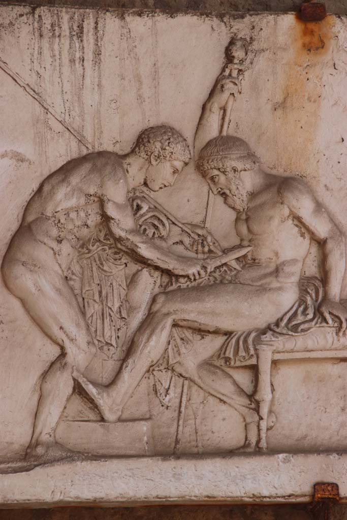 Ins. Or.I.2, Herculaneum. September 2017. Detail from plaster cast showing Achilles healing Telephus.
The myth was that Telephus could only be healed by the rust of Achilles’ spear, the spear which had wounded him. 
Photo courtesy of Klaus Heese.
