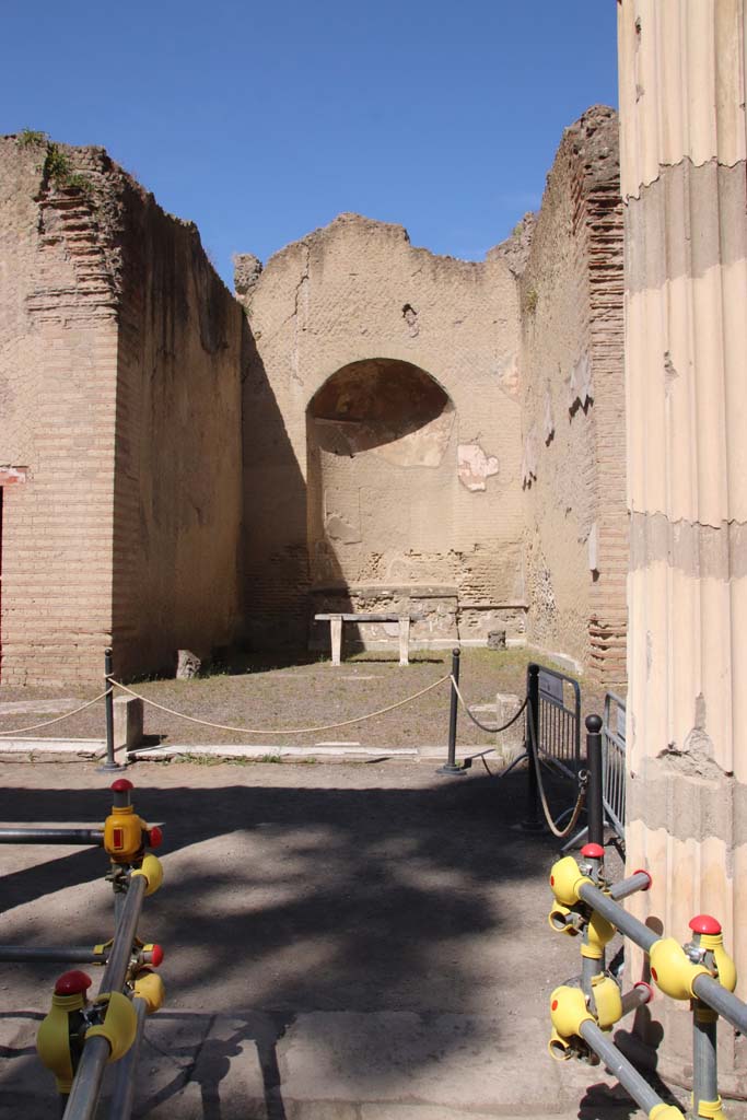 Ins. Orientalis II.4, Herculaneum, September 2019.  
Looking west from exit from the unexcavated palaestra, towards the apsed room.
Photo courtesy of Klaus Heese.

