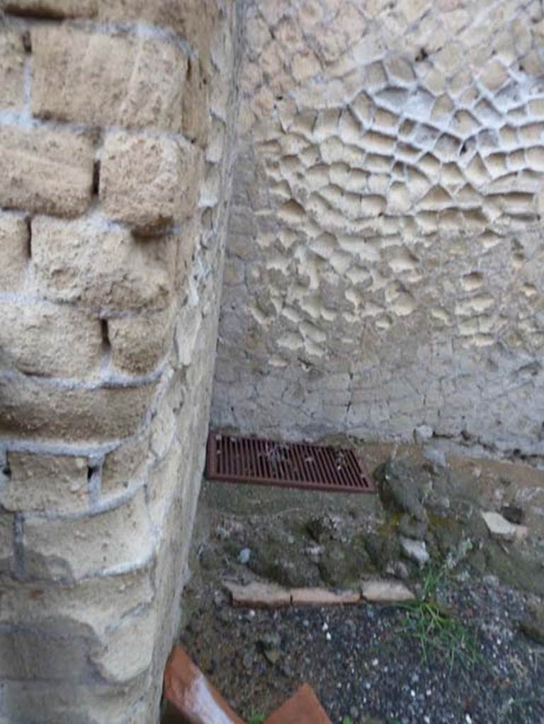 Ins. Orientalis II.15, Herculaneum. September 2015. 
Modern drain in north-west corner of workshop, site of latrine.
