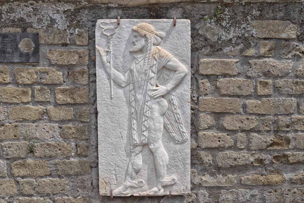 Herculaneum, April 2018. Reproduction relief of Mercury, from the shrine of Four Gods on the Sacred Area terrace.
Photo courtesy of Ian Lycett-King. Use is subject to Creative Commons Attribution-NonCommercial License v.4 International.
