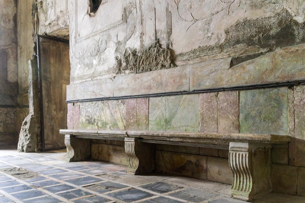 Herculaneum Suburban Baths. October 2023. 
Looking south along bench against west wall of tepidarium, with doorway to smaller original caldarium. Photo courtesy of Johannes Eber. 
