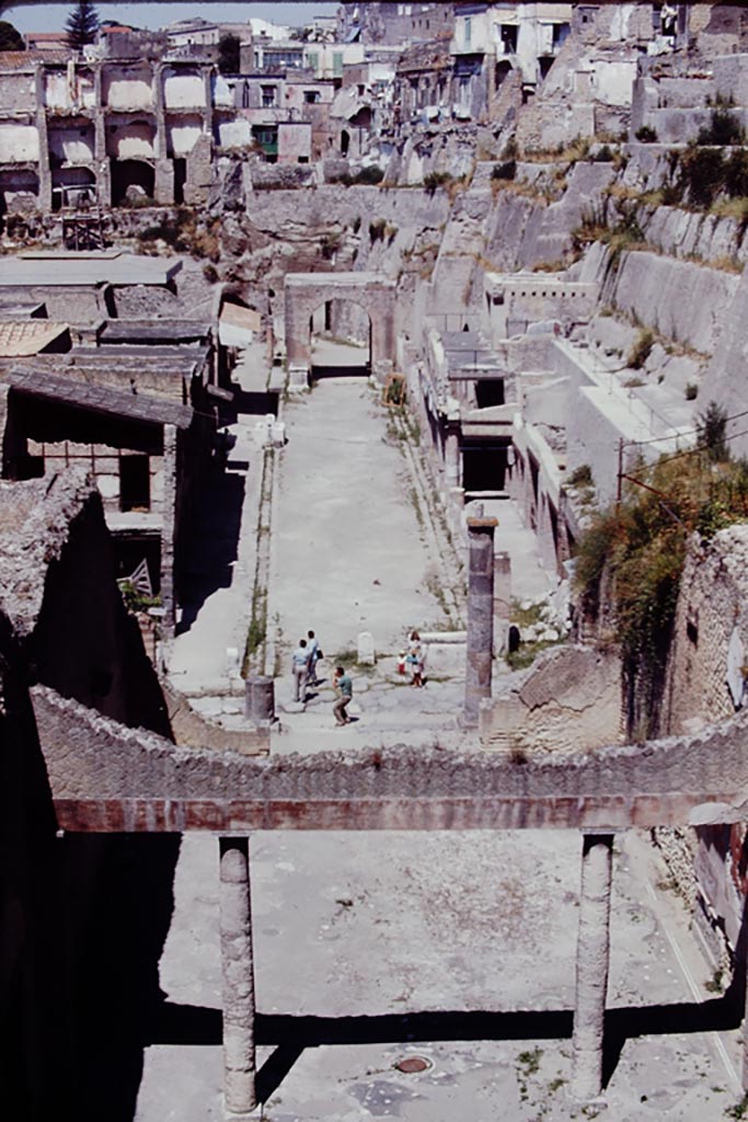 Looking west along Decumanus Maximus, Herculaneum, 1968, from the access bridge/roadway. Photo by Stanley A. Jashemski.   
Source: The Wilhelmina and Stanley A. Jashemski archive in the University of Maryland Library, Special Collections (See collection page) and made available under the Creative Commons Attribution-Non Commercial License v.4. See Licence and use details.
J68f1820


