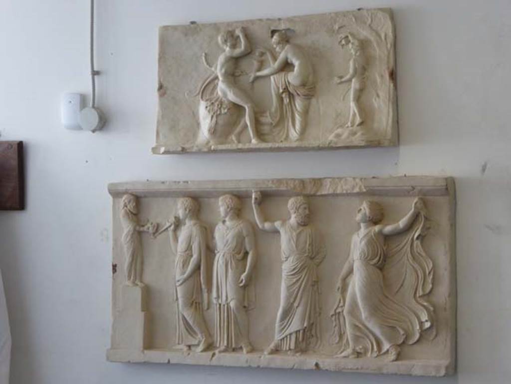 House of Dionysiac Reliefs, Herculaneum. September 2016. Two marble reliefs.
Inventory number 79613 (upper) found in 1997 and inventory number 88091 (lower) found in 2009.
Photo courtesy of Michael Binns.

