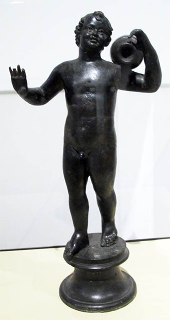Villa dei Papiri, Herculaneum. Bronze statuette of a putto.
Found in 1751, at south west corner.
Now in Naples Archaeological Museum. Inventory number 5023.
