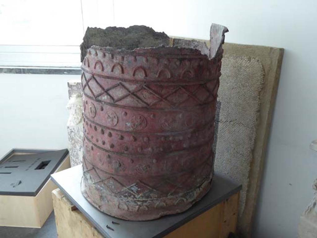 IV.2/1, Herculaneum, September 2016. 
A beautiful bucket made in embossed lead plate and decorated in relief, used as a reservoir of water, part of the kitchen furnishings. Photo courtesy of Michael Binns.
