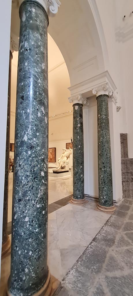 Naples Archaeological Museum, April 2023. 
Looking in towards beautiful marble columns in Arch leading into Herculaneum Augusteum gallery display.   
Photo courtesy of Giuseppe Ciaramella.

