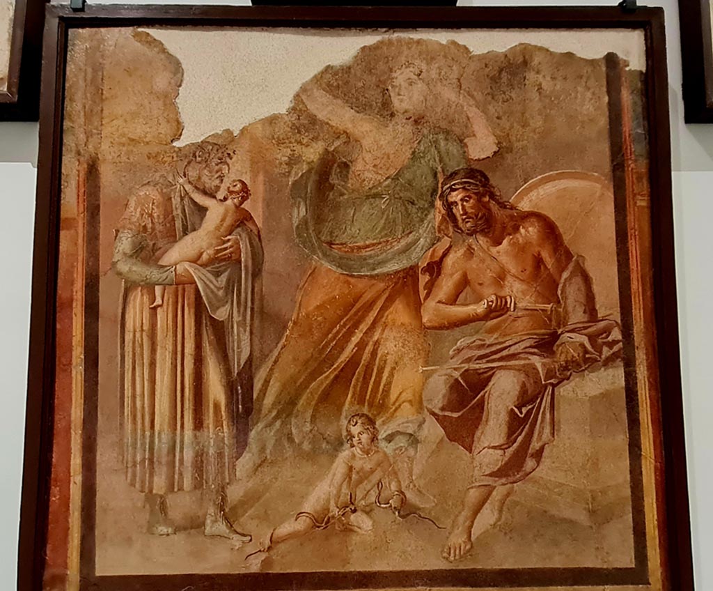 Herculaneum Augusteum. April 2023. 
Painting from lower row, on side wall, showing The infant Hercules strangling the serpents, inv.9012. 
On display in “Campania Romana” gallery in Naples Archaeological Museum.  Photo courtesy of Giuseppe Ciaramella.
