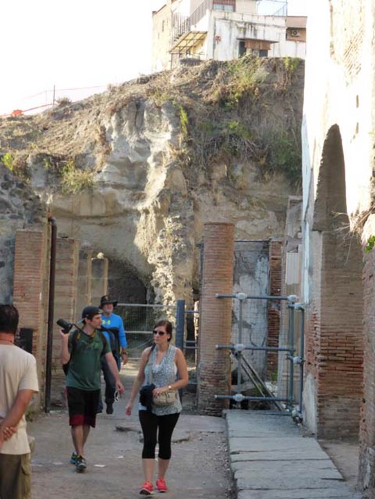 Herculaneum, September 2015.  Looking west along the front of the Augusteum, also known as Basilica, from the arch on its east side. Looking west along line of arched portico, which would have joined the eastern arch to the western arch. 
