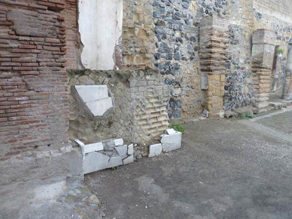 Herculaneum, September 2015.Statue base at north end of east side of four-sided arch.