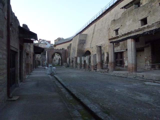 Decumanus Maximus, Herculaneum, October 2014.  Building on north side of the Decumanus Maximus, doorway numbered 10, on left, and number 11, on right.
Photo courtesy of Michael Binns.
