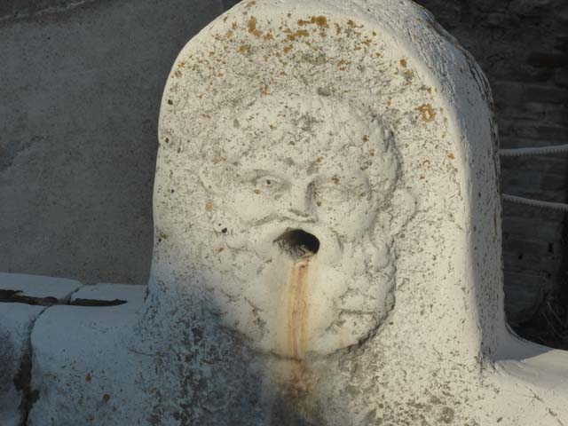 Decumanus Maximus, Herculaneum, May 2001.  Fountain decorated with head of Hercules, from fountain on east end of the Decumanus Maximus.  Photo courtesy of Current Archaeology.

