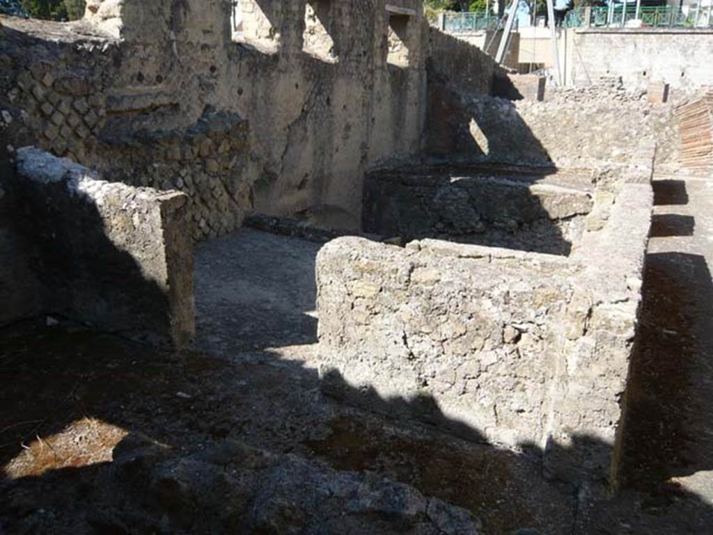 II.1 Herculaneum, September 2015. Steps in south-east corner of atrium, leading to service rooms on lower floor, where several skeletons were found in Bourbon times .