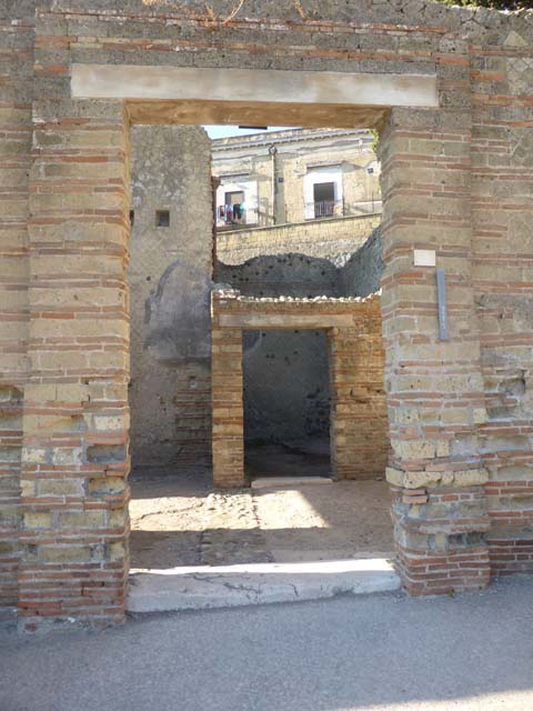 II.2 Herculaneum, September 2015. Present day entrance doorway, but originally this would have been the posticum doorway from the rear of the peristyle. The main doorway would have been entered from Cardo II, but has not yet been excavated into the open air.
